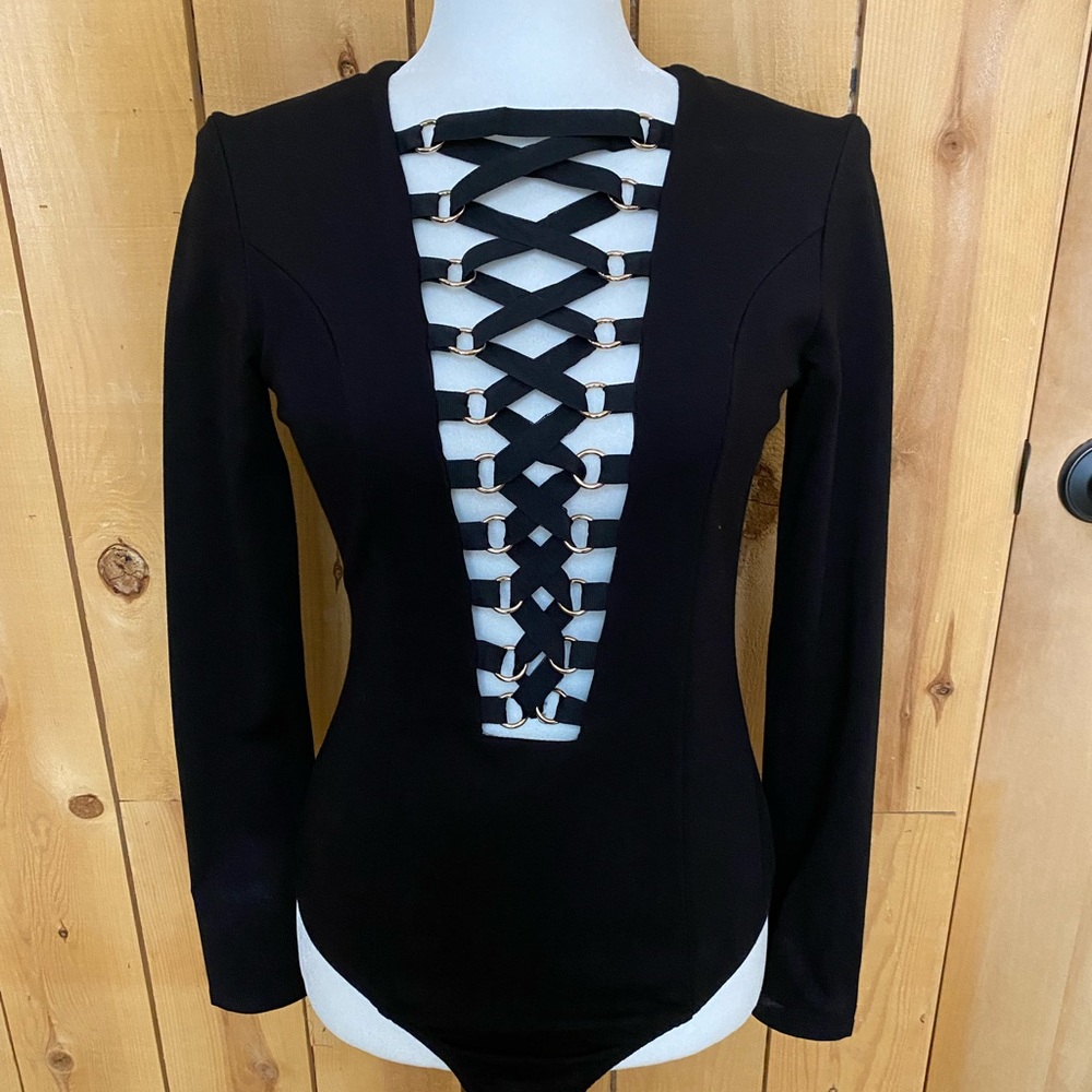 Lace up the front, sip up the back, black bodysuit.